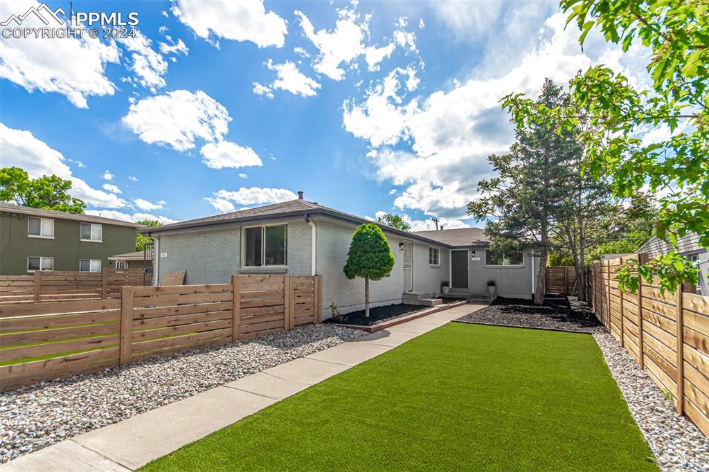 737 Utica Street Denver, CO 80204 - Photo 2 of 41 a front view of a house with a yard