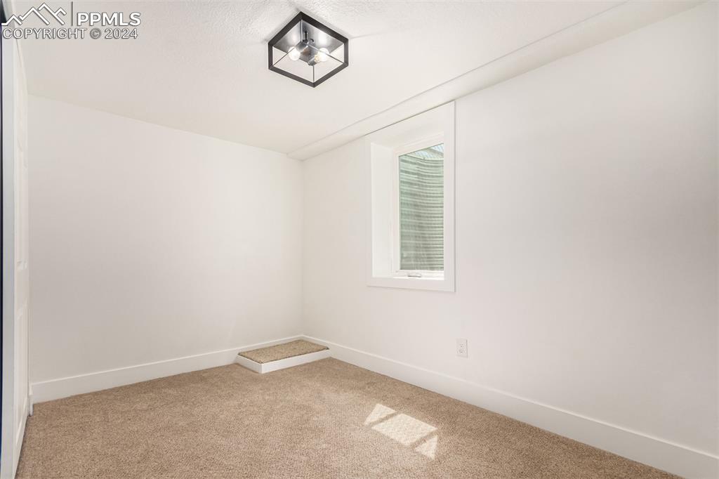 737 Utica Street Denver, CO 80204 - Photo 24 of 41 an empty room with windows