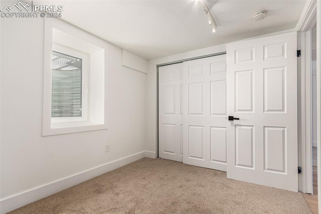 737 Utica Street Denver, CO 80204 - Photo 27 of 41 an empty room with windows