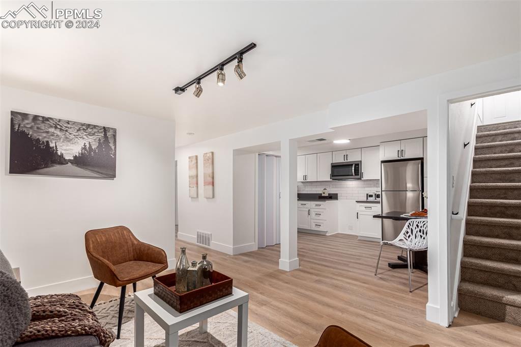 737 Utica Street Denver, CO 80204 - Photo 31 of 41 a living room with furniture and a wooden floor