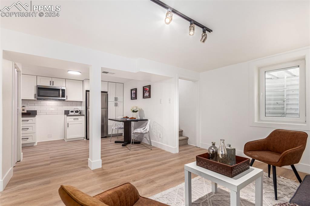 737 Utica Street Denver, CO 80204 - Photo 32 of 41 a living room with furniture and kitchen view