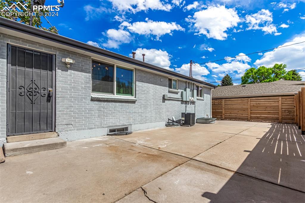 737 Utica Street Denver, CO 80204 - Photo 37 of 41 a backyard of a house with dishwasher a barbeque oven and outdoor seating