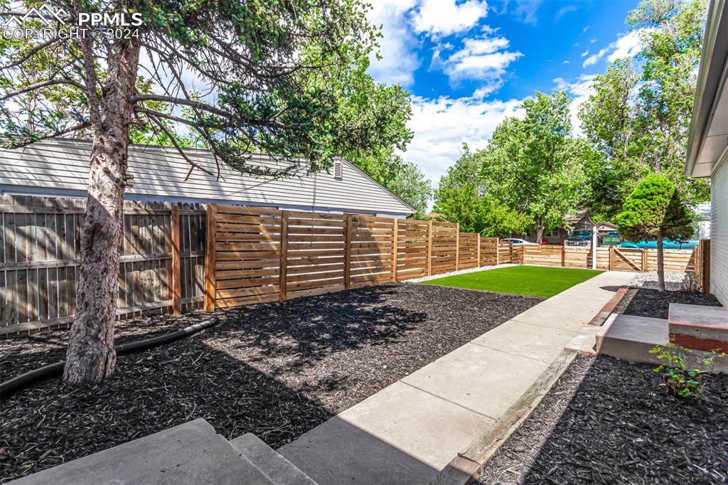 737 Utica Street Denver, CO 80204 - Photo 4 of 41 a view of a backyard with a garden