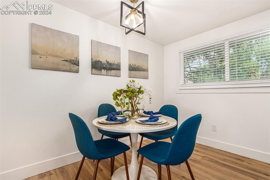 737 Utica Street Denver, CO 80204 - Photo 9 of 41 a dining room with furniture and window