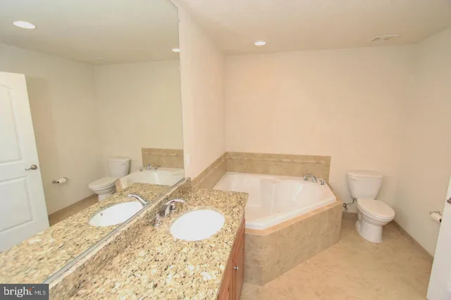 an empty room with a empty space and windows