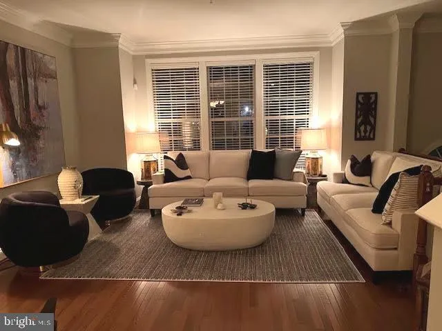 a kitchen with a stove a sink a microwave a dining table and chairs