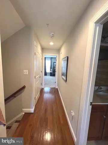 a view of a patio with couches table and chairs and potted plants
