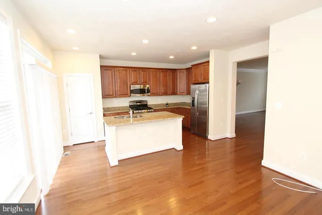 a kitchen with a sink and a window