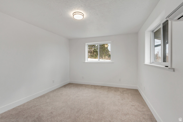 337 West 2900th Street South Bountiful, UT 84010 - Photo 30 of 35 Unfurnished room with a mini split for heating / cooling and light carpet