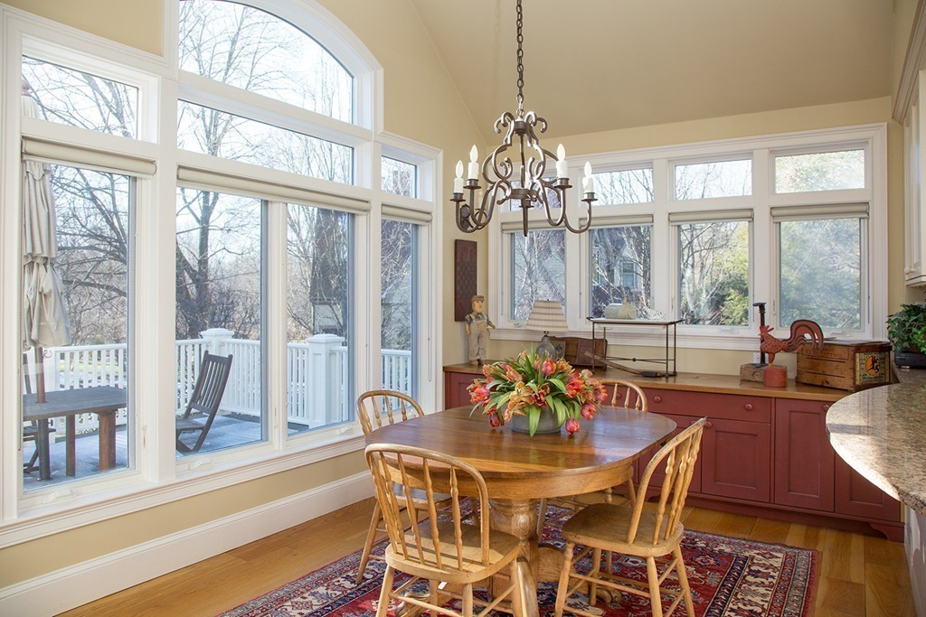 59 Tamworth Road Newton, MA 02468 - Photo 5 of 11 a view of a dining room with furniture large windows and wooden floor