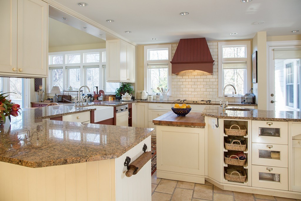 59 Tamworth Road Newton, MA 02468 - Photo 6 of 11 a kitchen with a stove a sink and a cabinets
