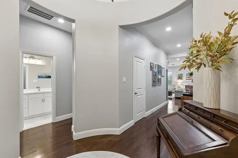 a room with wooden floor and furniture