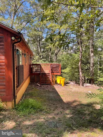 a view of a backyard with a small cabin