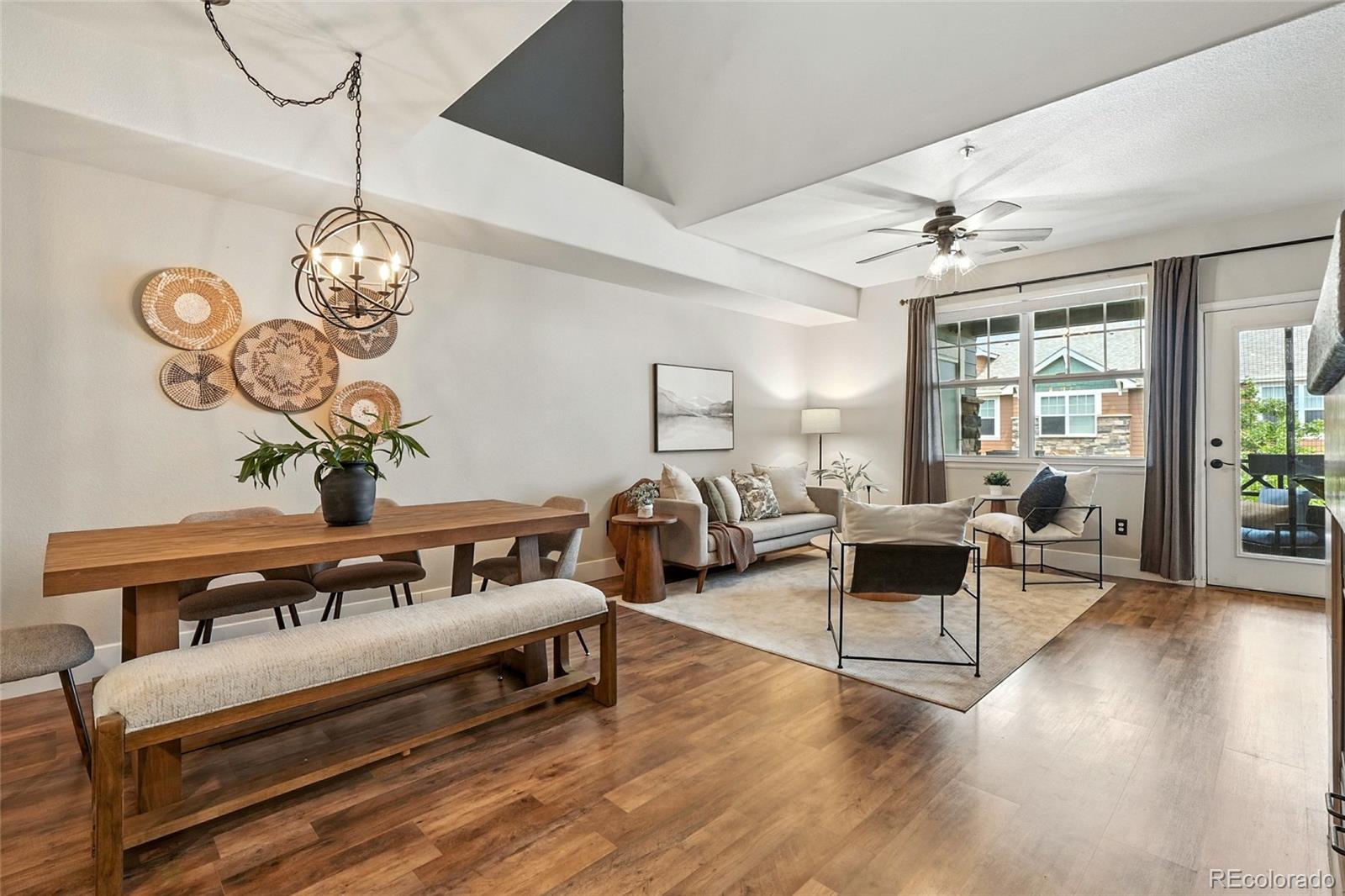 7080 Simms Street, Unit 204 Arvada, CO 80004 - Photo 12 of 49 a bedroom with furniture and a chandelier