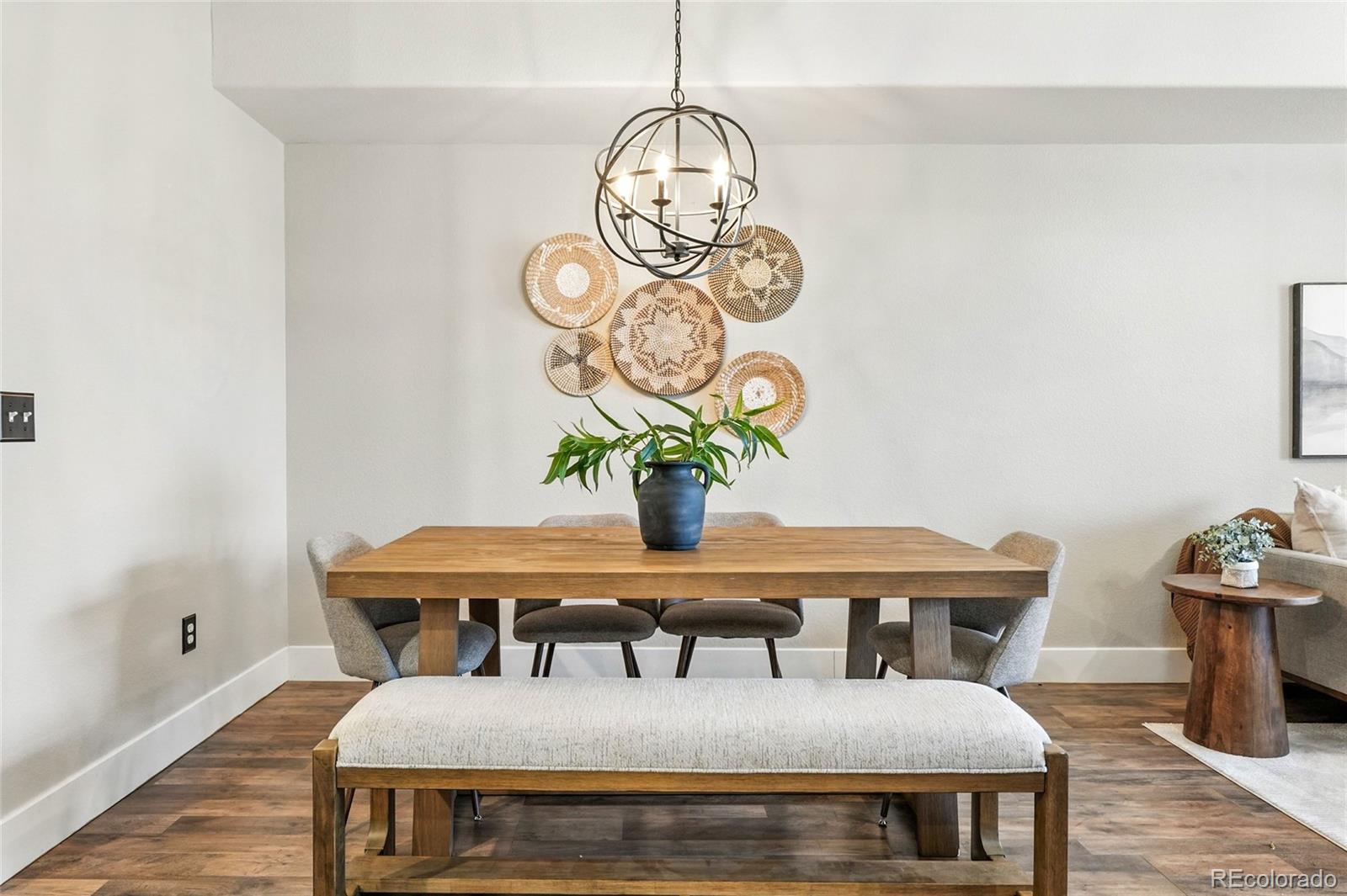 7080 Simms Street, Unit 204 Arvada, CO 80004 - Photo 13 of 49 a dining room with furniture and wooden floor