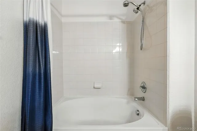 an aerial view of a house with a yard and garden