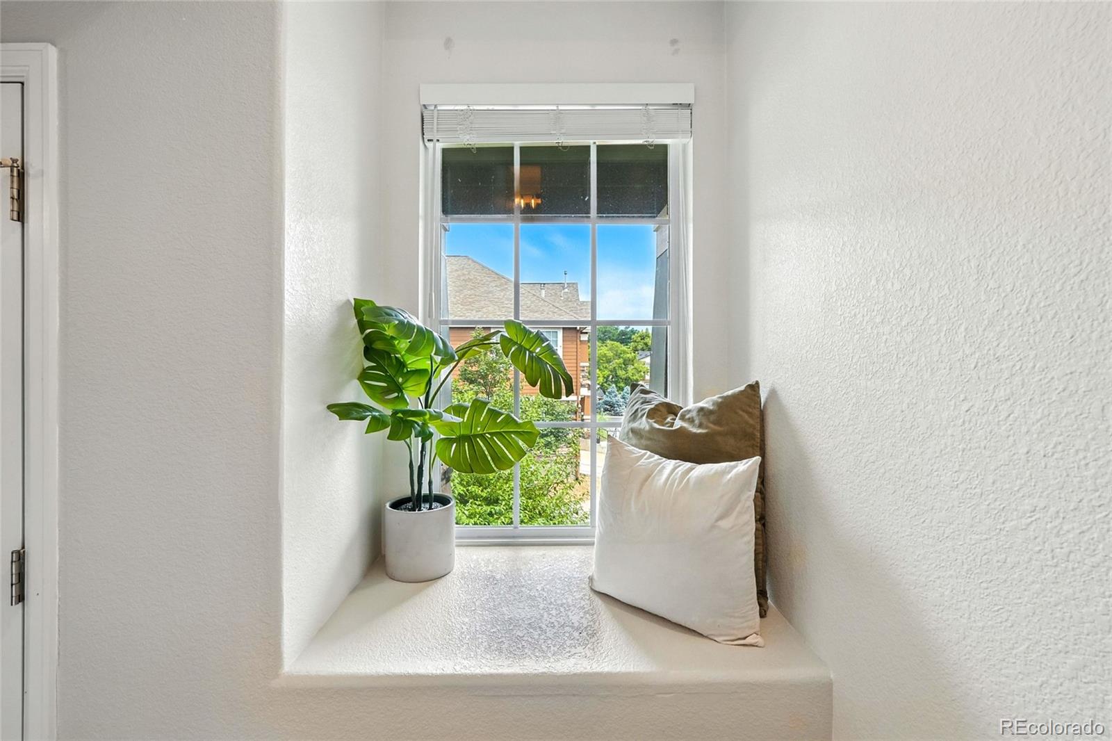 7080 Simms Street, Unit 204 Arvada, CO 80004 - Photo 28 of 49 a white vase with white and yellow flowers