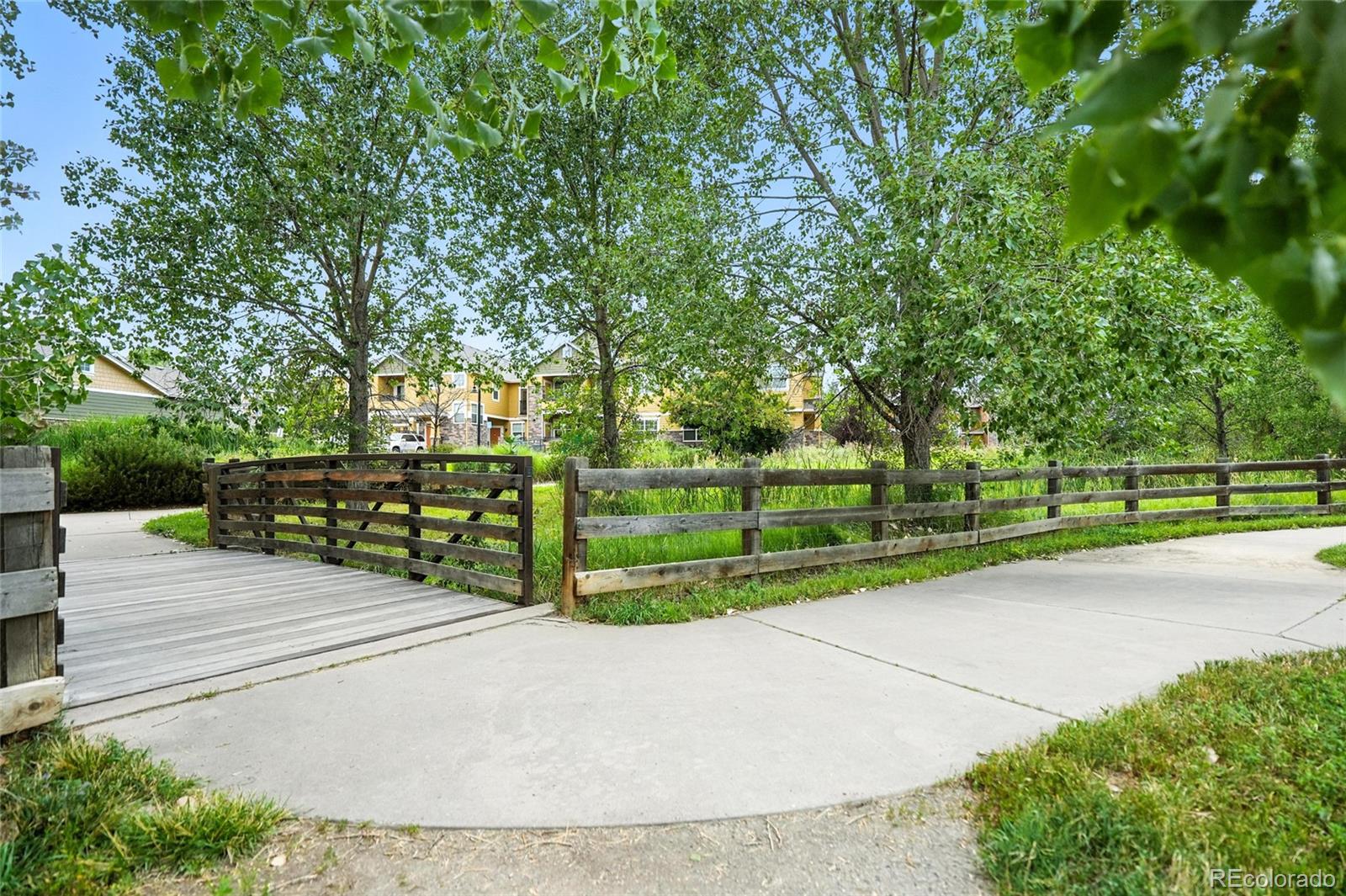 7080 Simms Street, Unit 204 Arvada, CO 80004 - Photo 42 of 49 a view of park with large trees