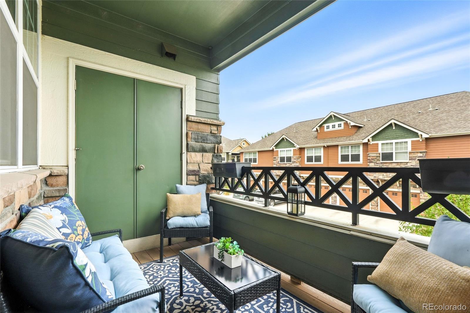 7080 Simms Street, Unit 204 Arvada, CO 80004 - Photo 43 of 49 a view of a balcony with furniture