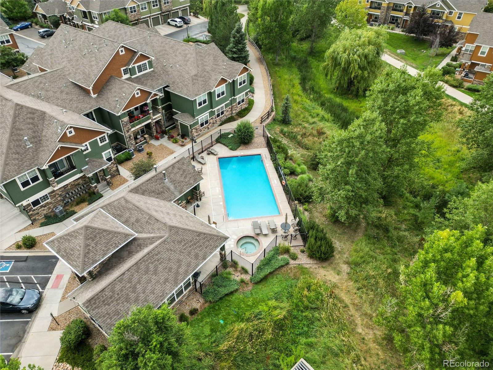7080 Simms Street, Unit 204 Arvada, CO 80004 - Photo 45 of 49 an aerial view of a house with a yard and garden