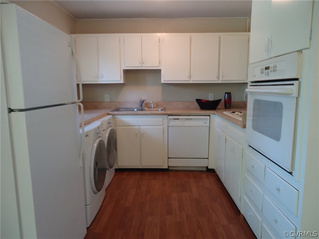 Solid hardwood kitchen cabinets are white, neutral