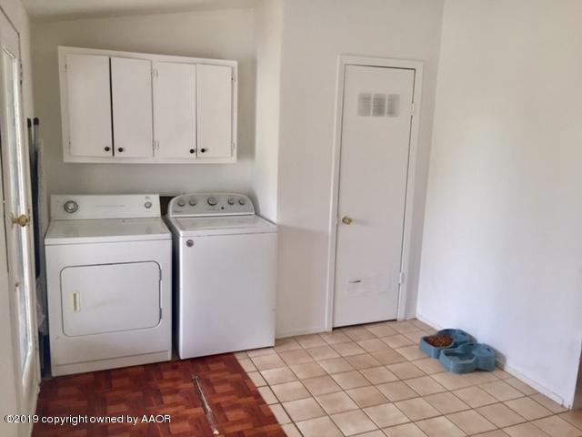 4219 South Ong Street Amarillo, TX 79110 - Photo 16 of 24 a view of a storage & utility room with washer and dryer