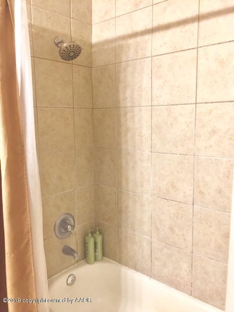 4219 South Ong Street Amarillo, TX 79110 - Photo 19 of 24 a bathroom with a shower