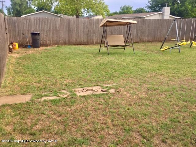 4219 South Ong Street Amarillo, TX 79110 - Photo 20 of 24 a view of backyard with wooden fence