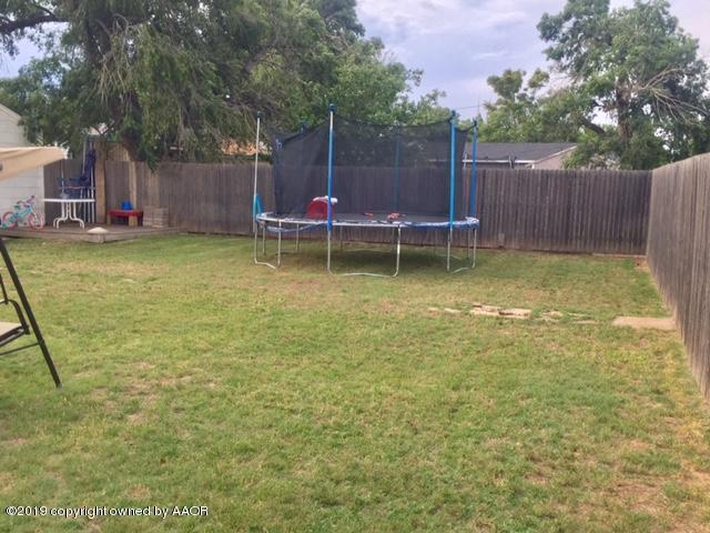 4219 South Ong Street Amarillo, TX 79110 - Photo 22 of 24 a view of a yard with a slide