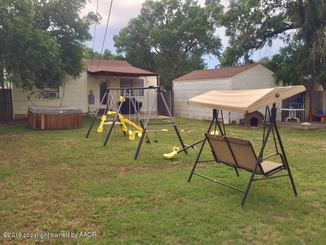 4219 South Ong Street Amarillo, TX 79110 - Photo 23 of 24 a view of an house with backyard and a slide