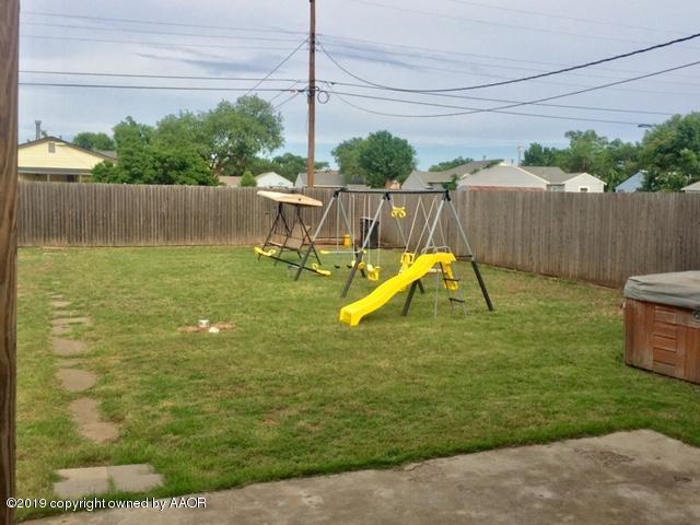 4219 South Ong Street Amarillo, TX 79110 - Photo 24 of 24 a view of a yard with a slide