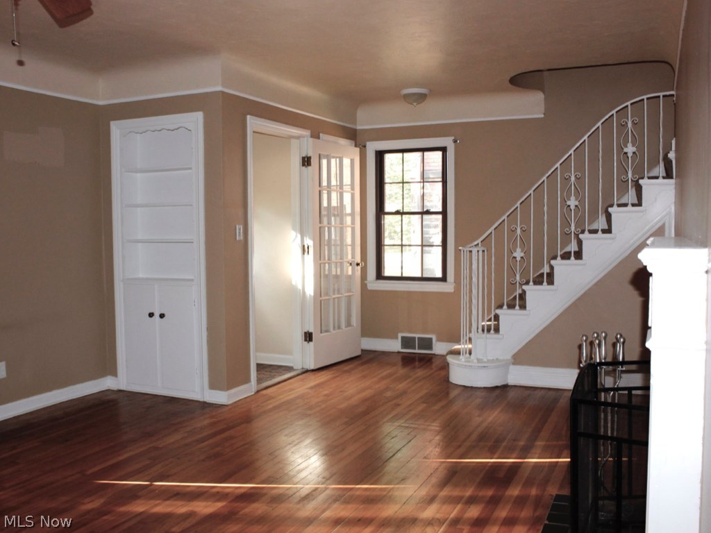 2187 Edgerton Road Cleveland, OH 44118 - Photo 2 of 14 LIVING ROOM SHOWING ENTRY, SHELVING, BEAUTIFUL WOOD FLOOR.....