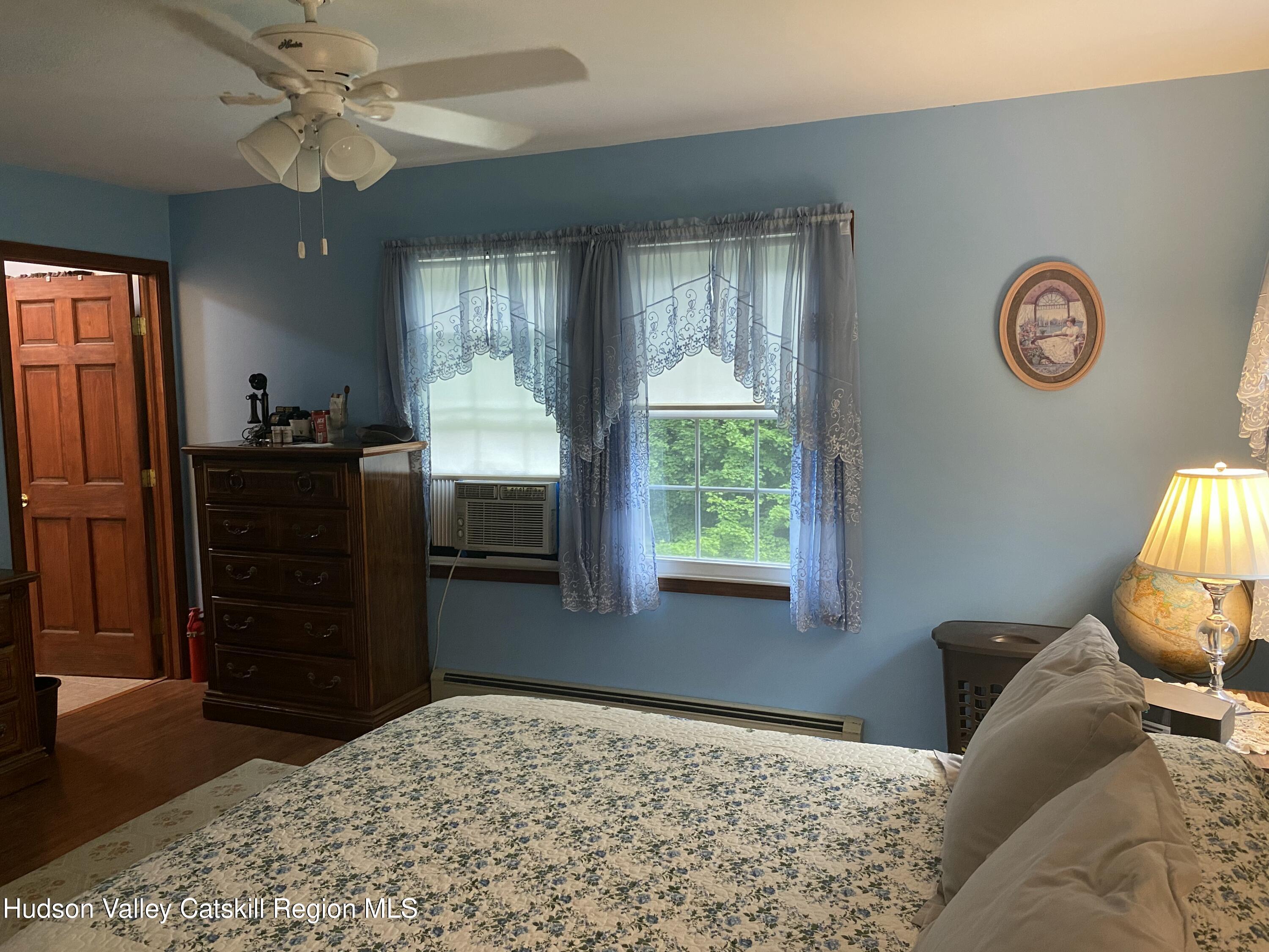 22 Beacham Road Rhinebeck, NY 12572 - Photo 11 of 38 a bed room with a bed and a dresser
