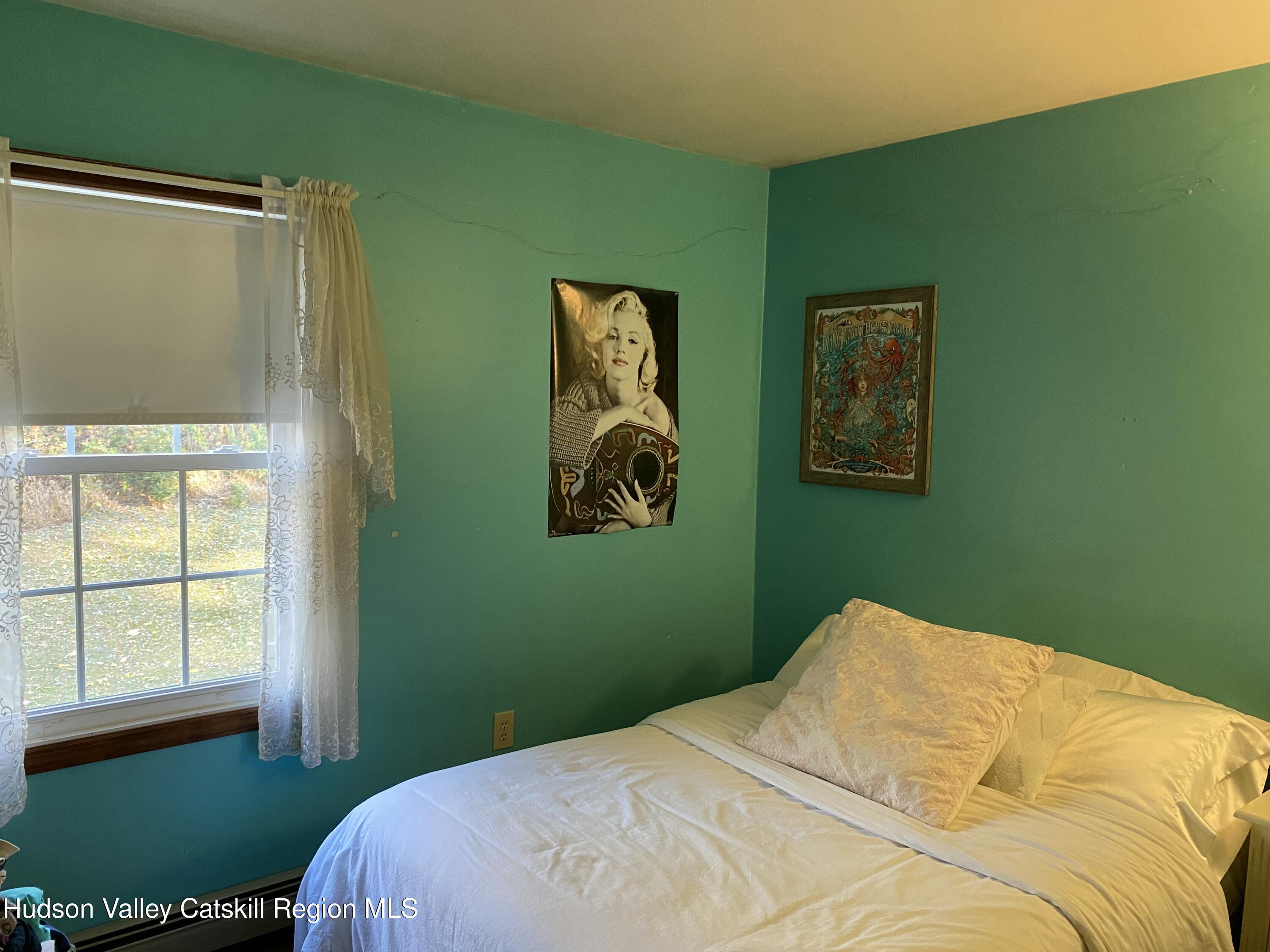 22 Beacham Road Rhinebeck, NY 12572 - Photo 14 of 38 a bedroom with a bed and a window