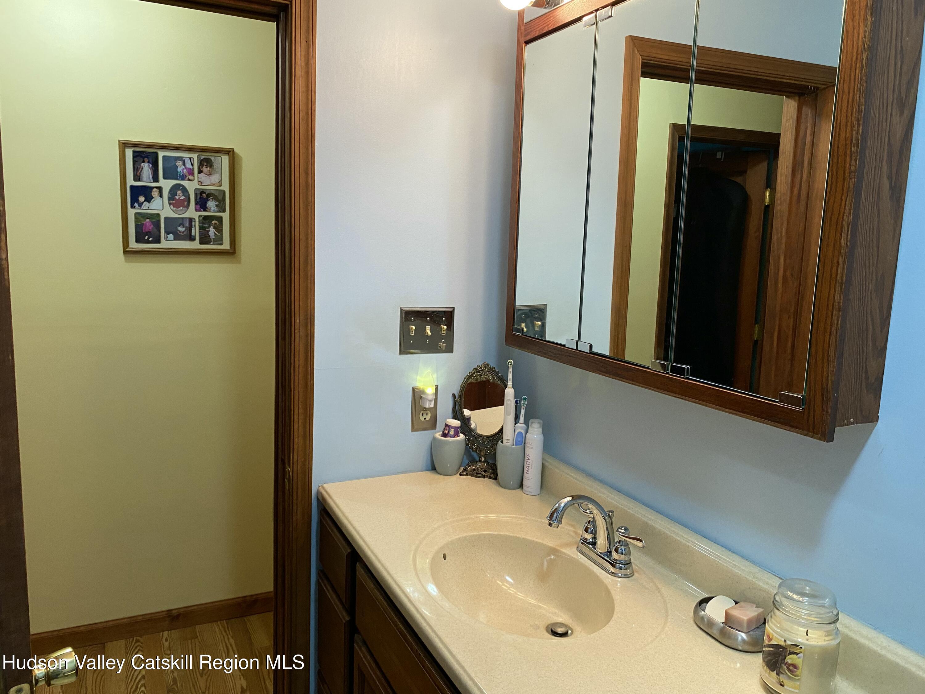 22 Beacham Road Rhinebeck, NY 12572 - Photo 15 of 38 a bathroom with a sink and a mirror