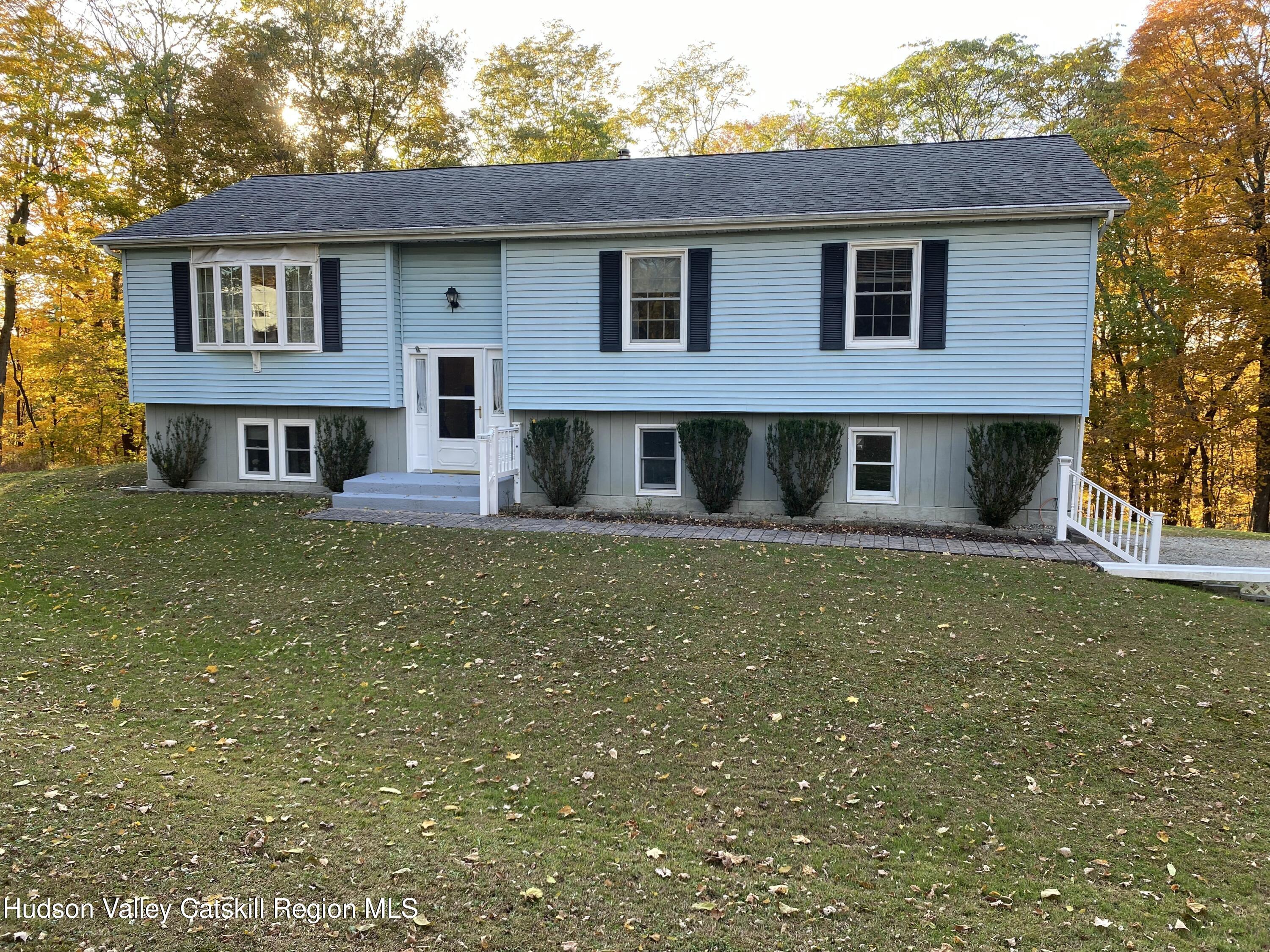 22 Beacham Road Rhinebeck, NY 12572 - Photo 3 of 38 a front view of a house with garden