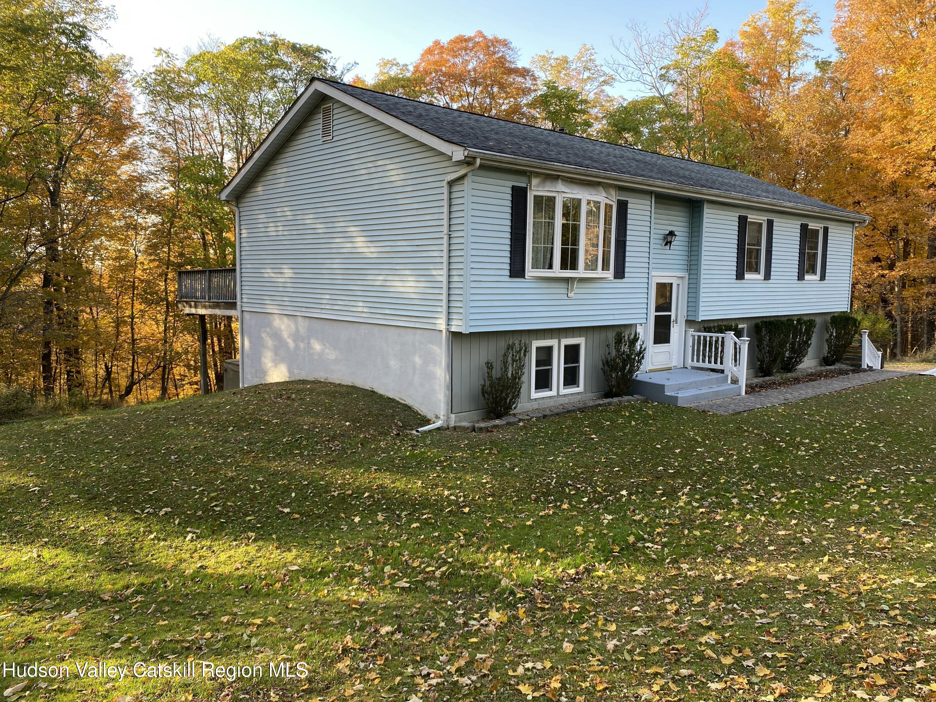 22 Beacham Road Rhinebeck, NY 12572 - Photo 4 of 38 a front view of a house with a yard