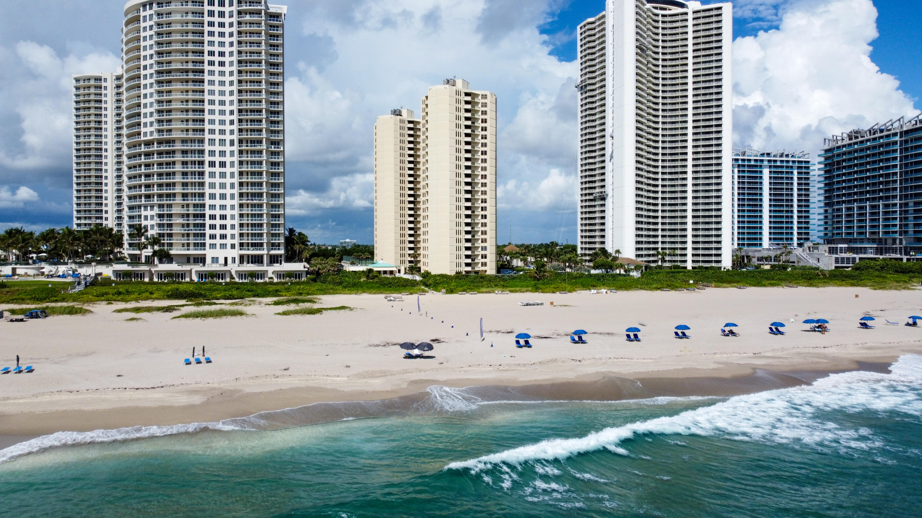 a view of a street with tall buildings