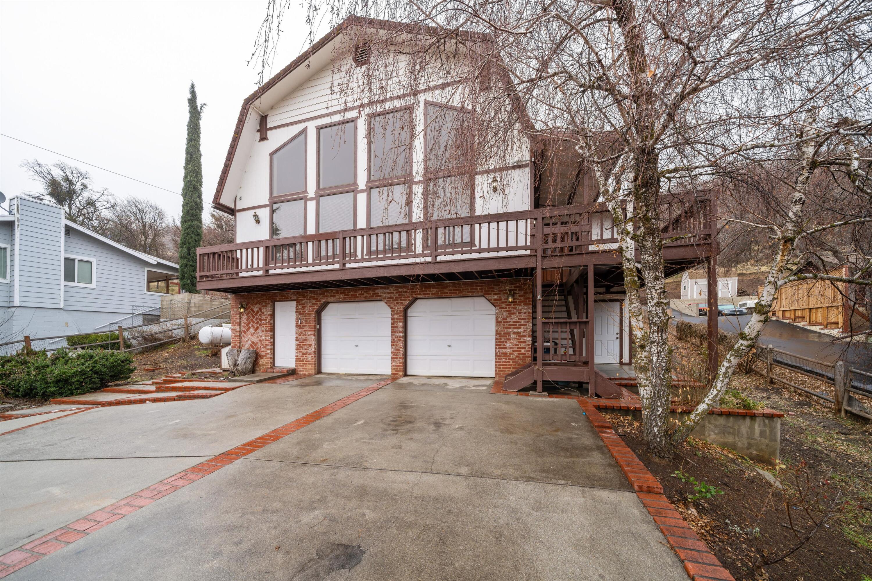18249 Alps Drive Tehachapi, CA 93561 - Photo 2 of 32 a view of a white building with large windows