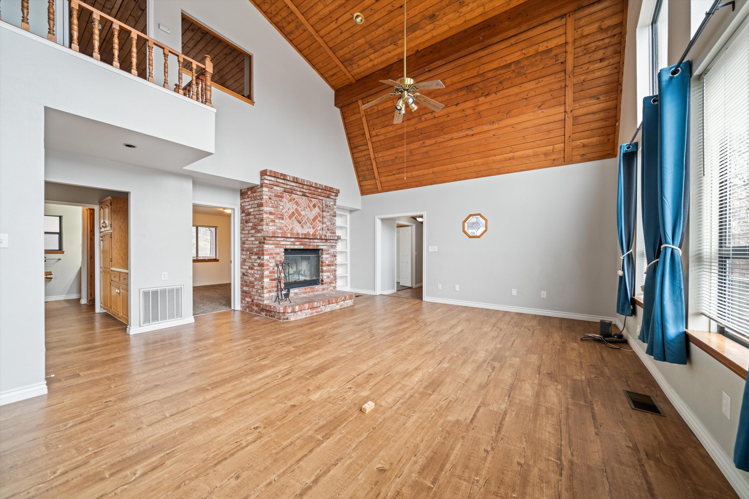 18249 Alps Drive Tehachapi, CA 93561 - Photo 23 of 32 a view of a livingroom with wooden floor and a staircase