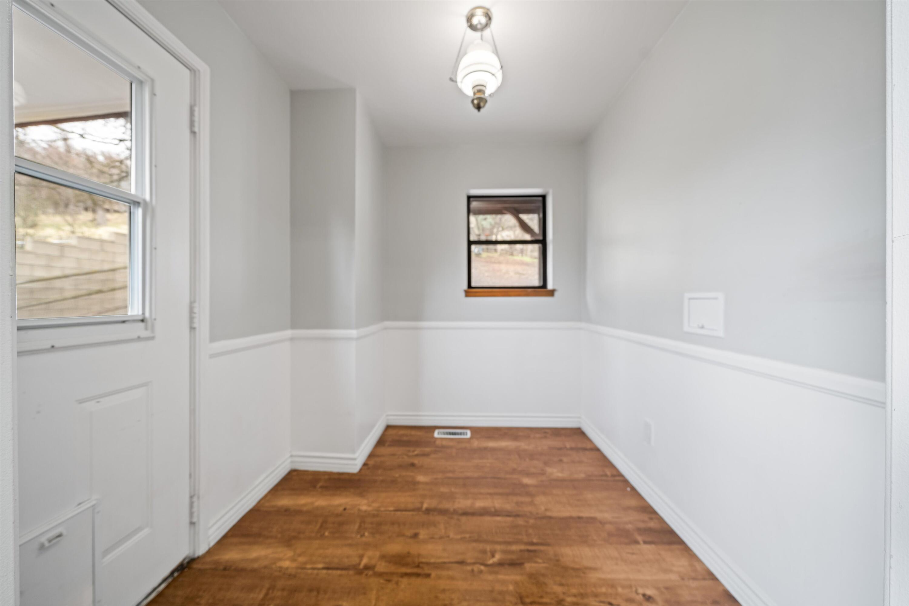 18249 Alps Drive Tehachapi, CA 93561 - Photo 30 of 32 wooden floor in an empty room with a window
