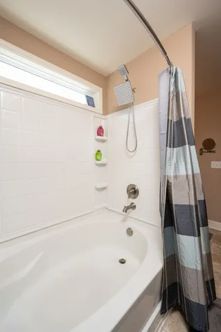 a bathroom with a white bath tub