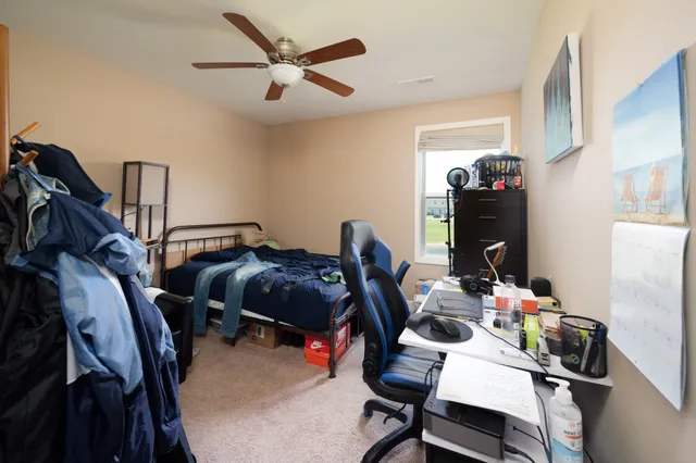 a bedroom with furniture and a window