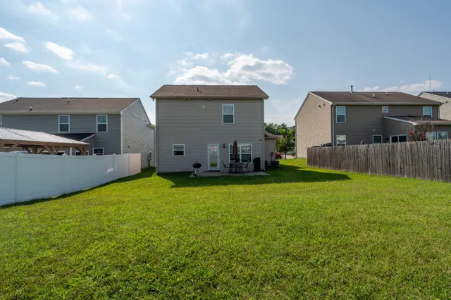 a view of a back yard of the house