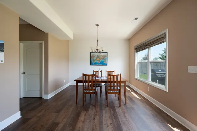 a dining room with furniture window wooden floor