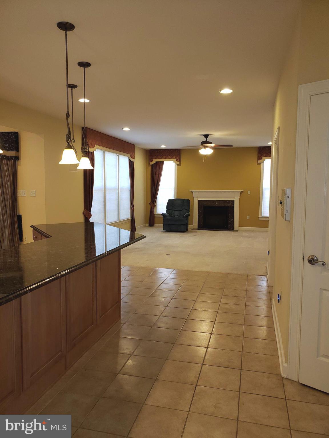 101 Mountain Laurel Boulevard Ranson, WV 25438 - Photo 11 of 43 Family room off kitchen w/ gas fireplace