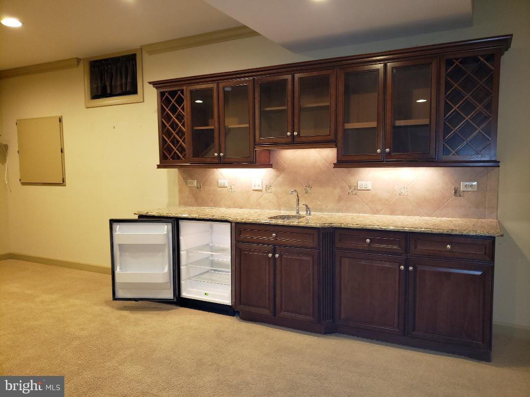101 Mountain Laurel Boulevard Ranson, WV 25438 - Photo 40 of 43 Granite counter w/ sink & wine chiller