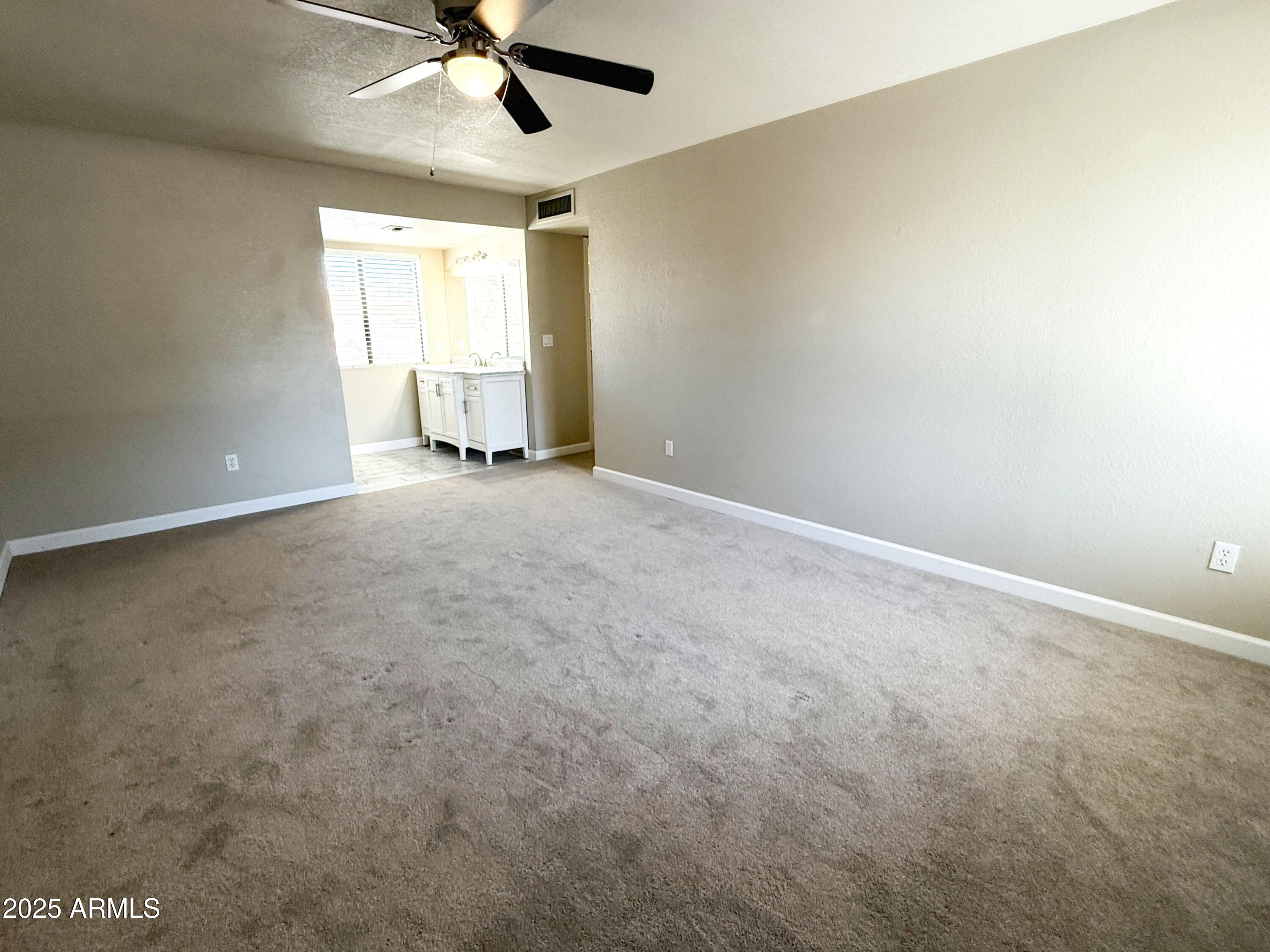 1529 East Edgewater Drive Tempe, AZ 85283 - Photo 13 of 34 a view of an empty room with a window