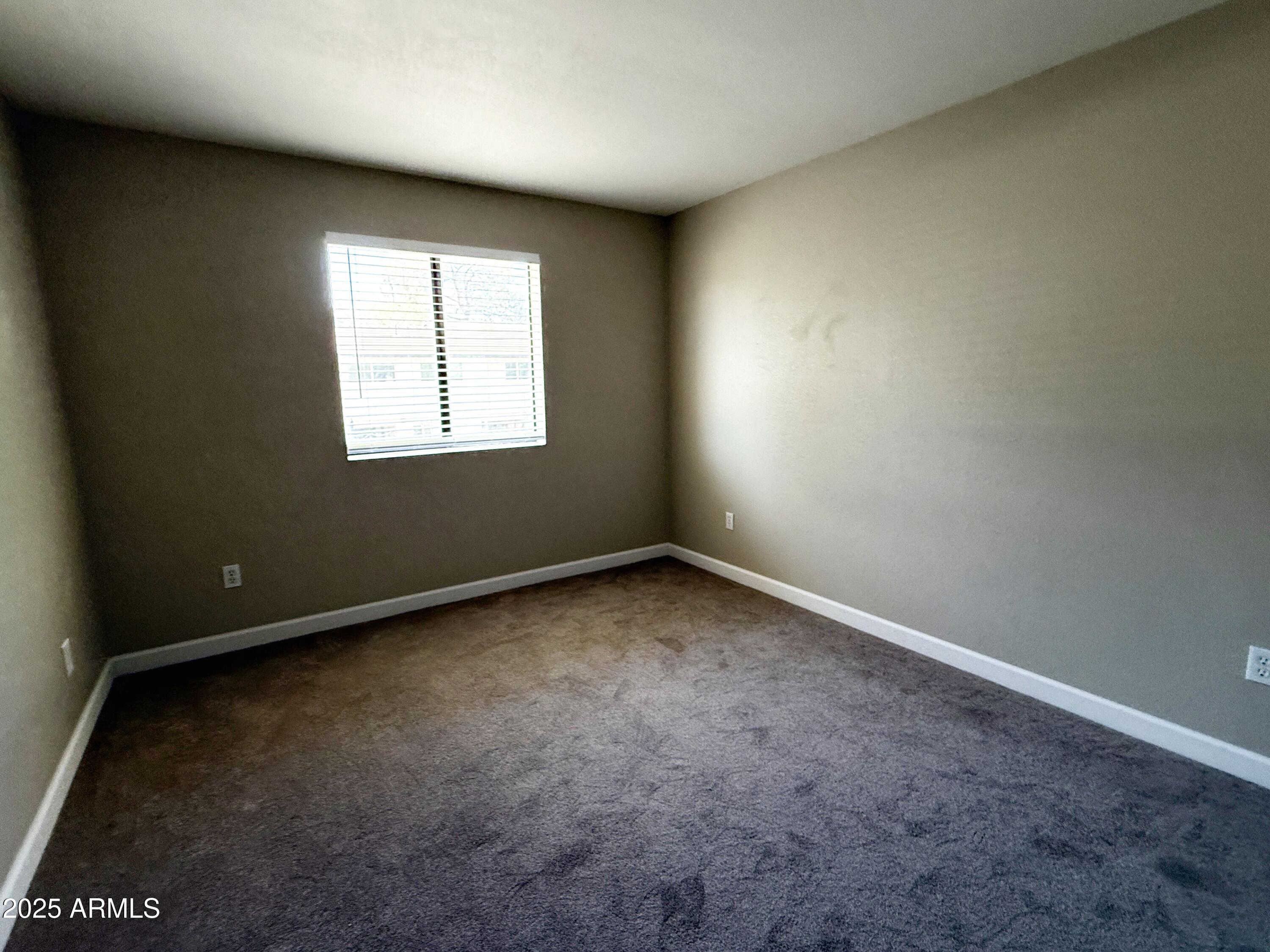1529 East Edgewater Drive Tempe, AZ 85283 - Photo 16 of 34 an empty room with a window