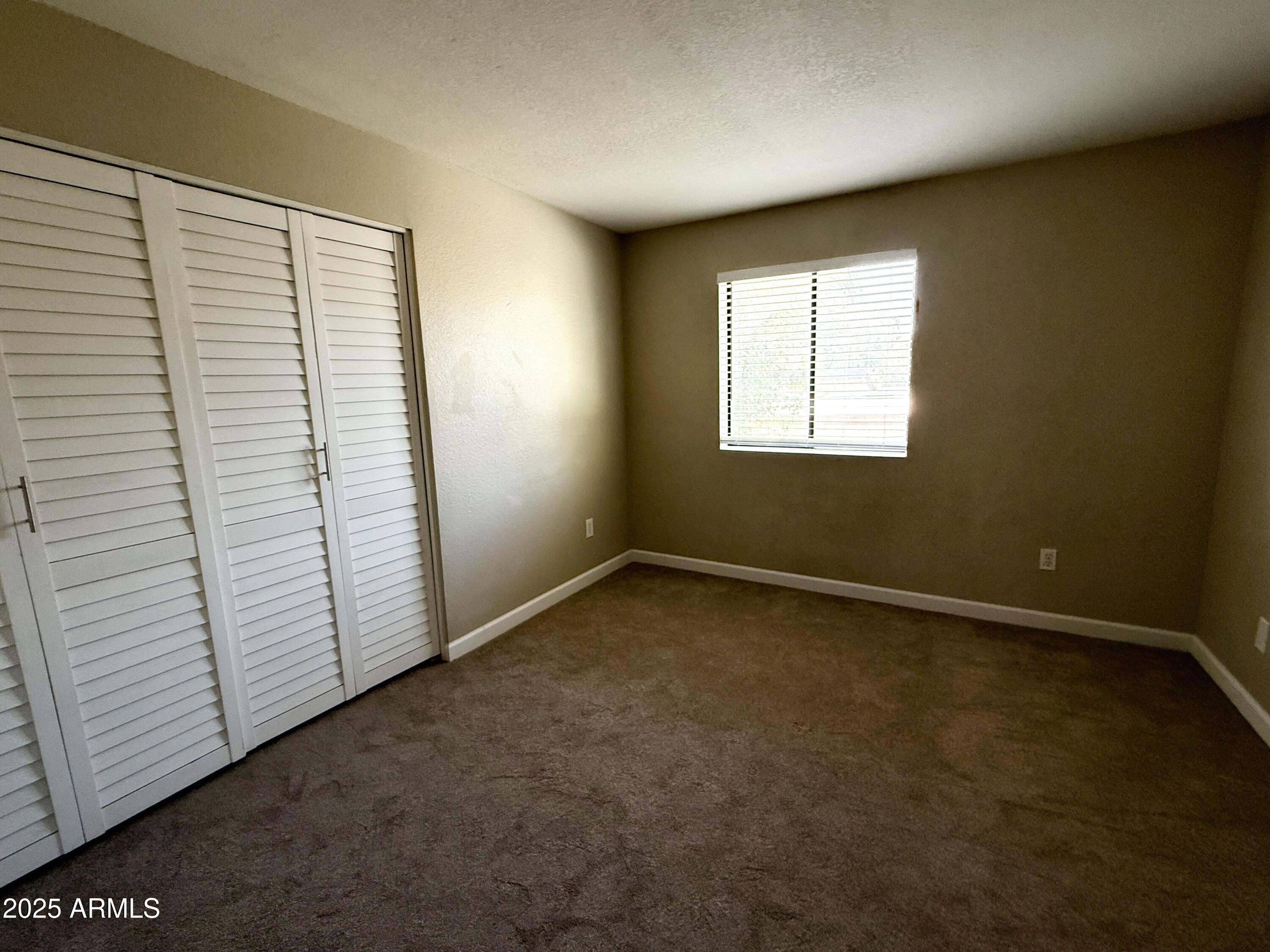 1529 East Edgewater Drive Tempe, AZ 85283 - Photo 19 of 34 an empty room with a window
